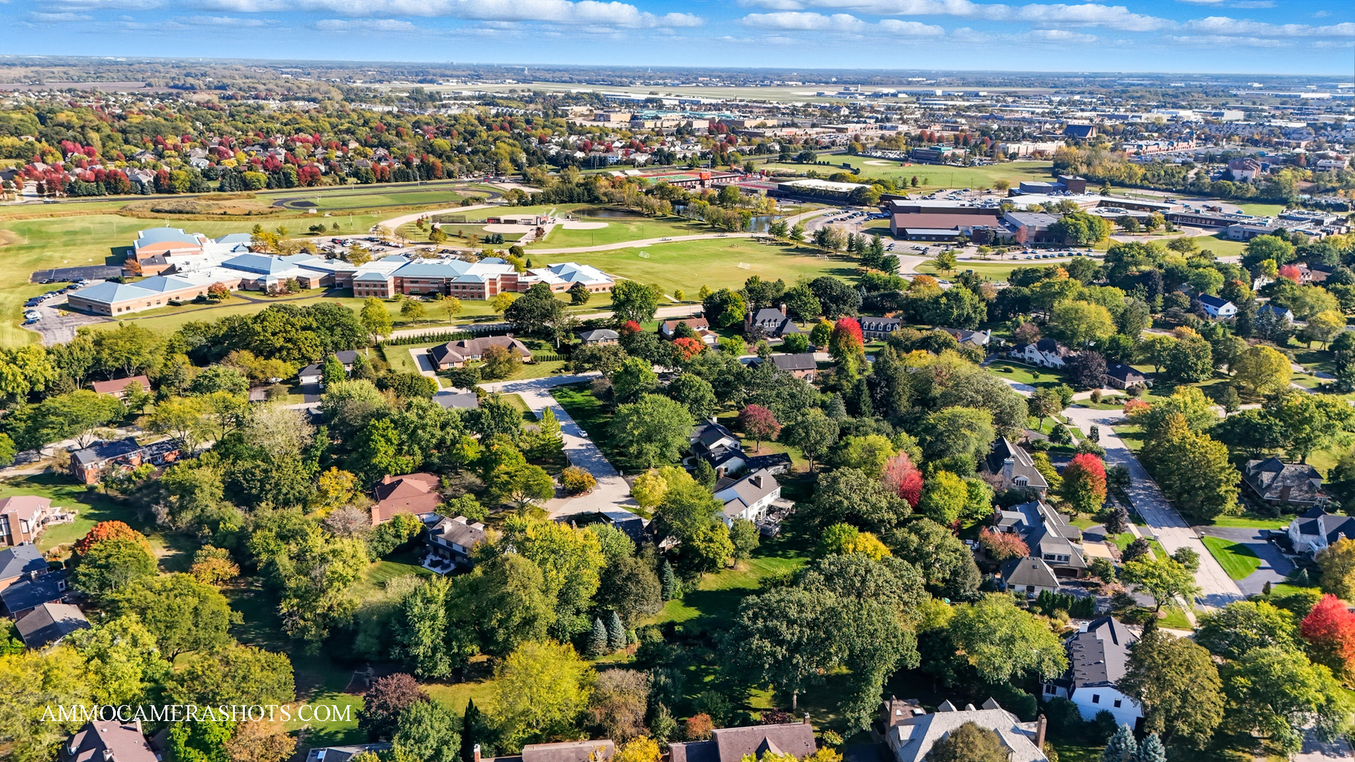 12 Highgate Court St. Charles, IL 60174 - Photo 60 of 60 an aerial view of a city with lots of residential buildings and mountain view in back
