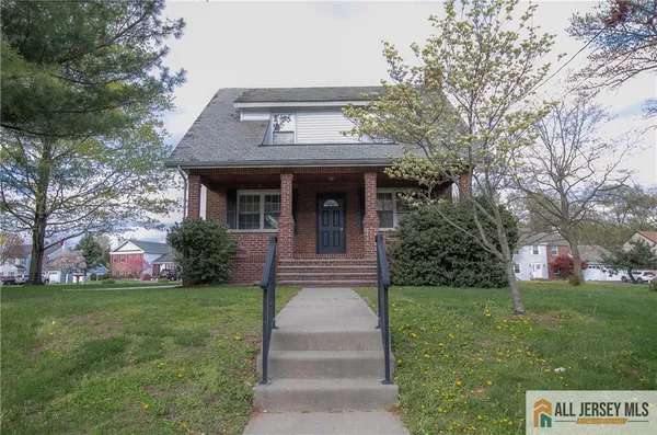a front view of house with garden