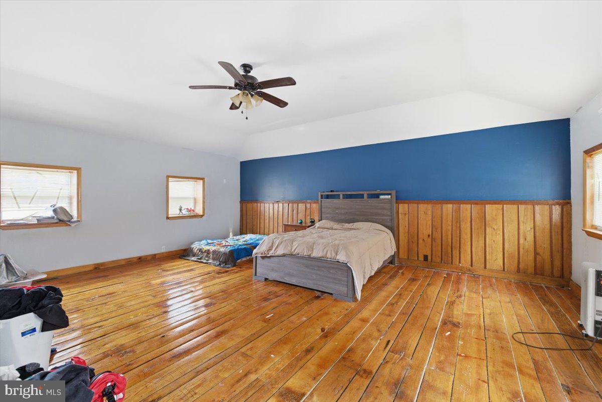 159 Colony Villiage Cresco, PA 18326 - Photo 27 of 105 a bedroom with a bed and wooden floor