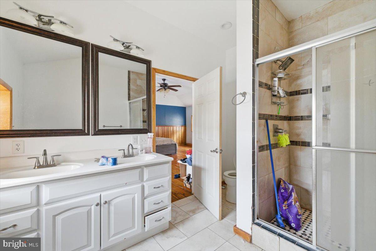 159 Colony Villiage Cresco, PA 18326 - Photo 28 of 105 a en suite bathroom with a sink mirror and vanity
