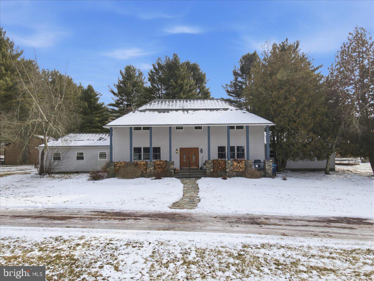 159 Colony Villiage Cresco, PA 18326 - Photo 3 of 105 a front view of a house with a yard covered in snow