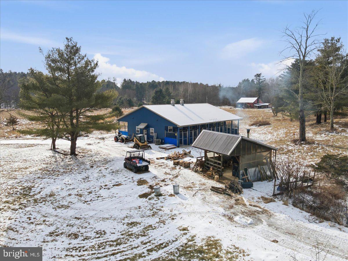 159 Colony Villiage Cresco, PA 18326 - Photo 6 of 105 a view of a patio with a table and chairs under an umbrella