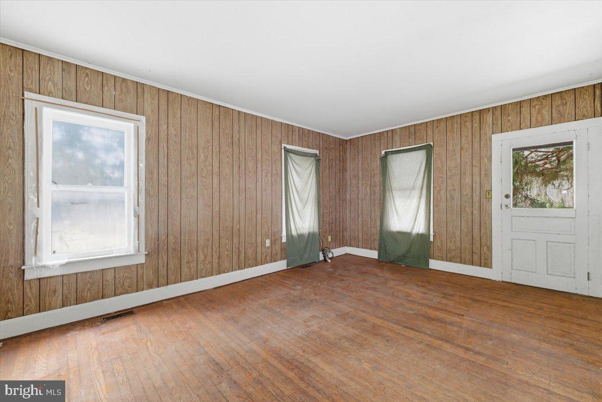 159 Colony Villiage Cresco, PA 18326 - Photo 81 of 105 an empty room with wooden floor and windows