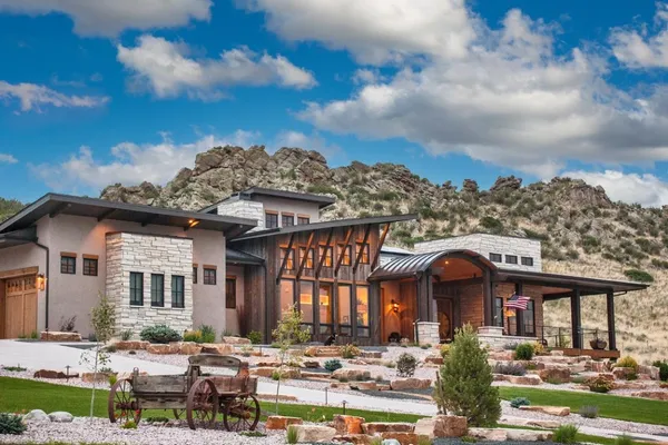 a front view of a residential apartment building with a yard