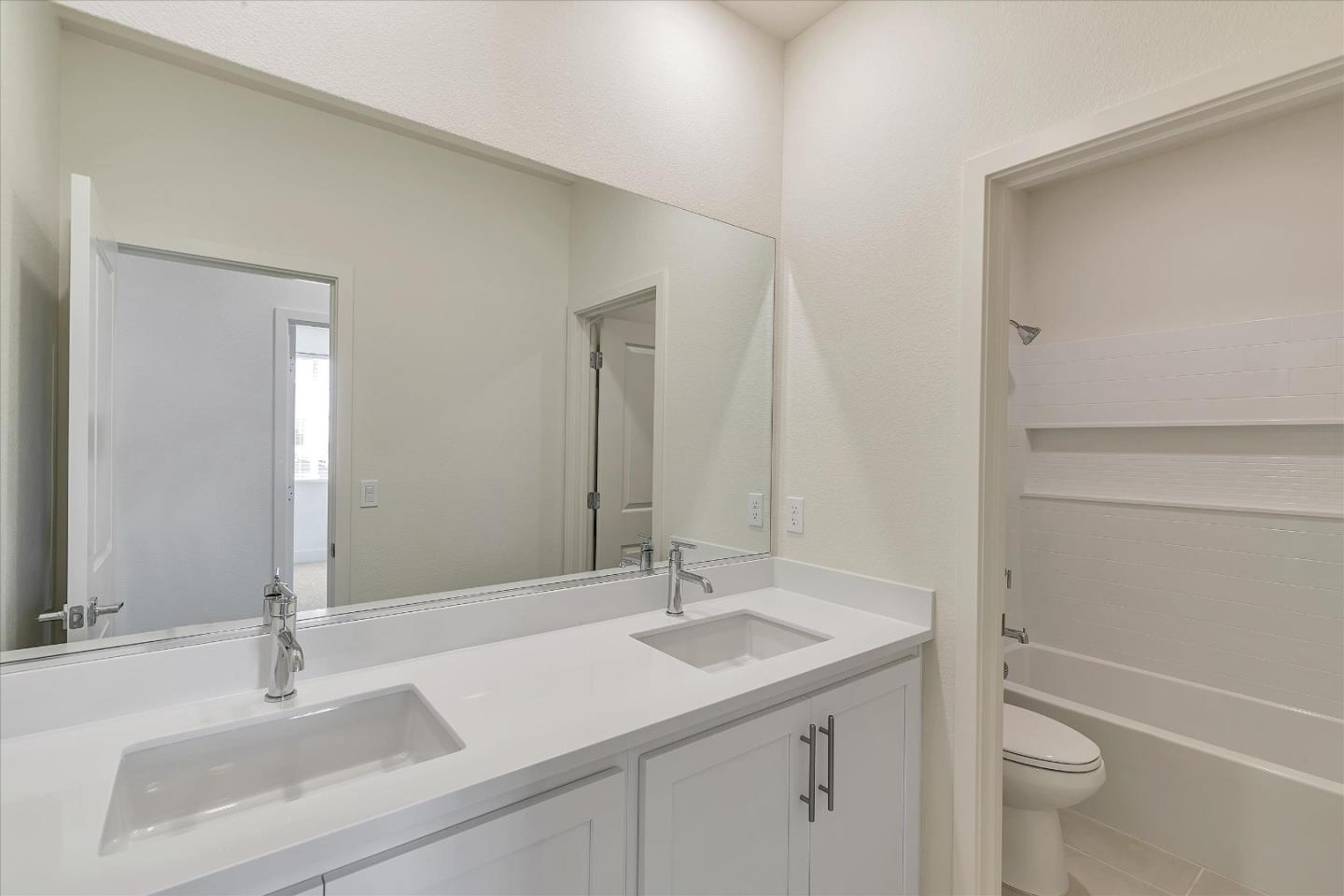 5459 Posner Avenue Tracy, CA 95377 - Photo 21 of 29 a bathroom with a sink toilet and shower
