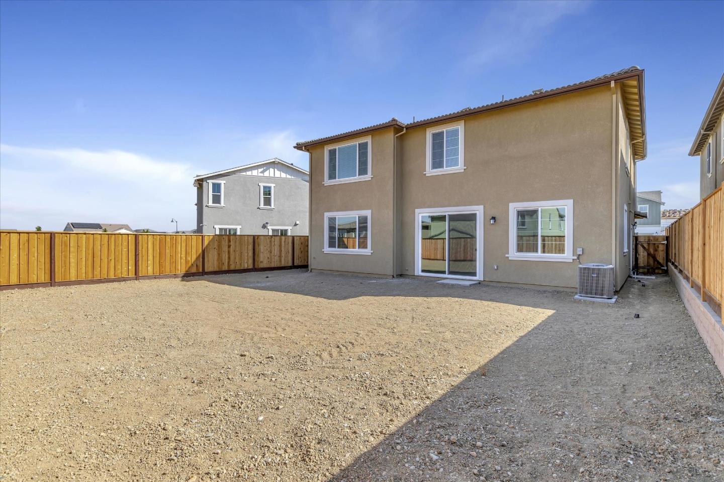 5459 Posner Avenue Tracy, CA 95377 - Photo 25 of 29 a front view of a house with a yard and garage