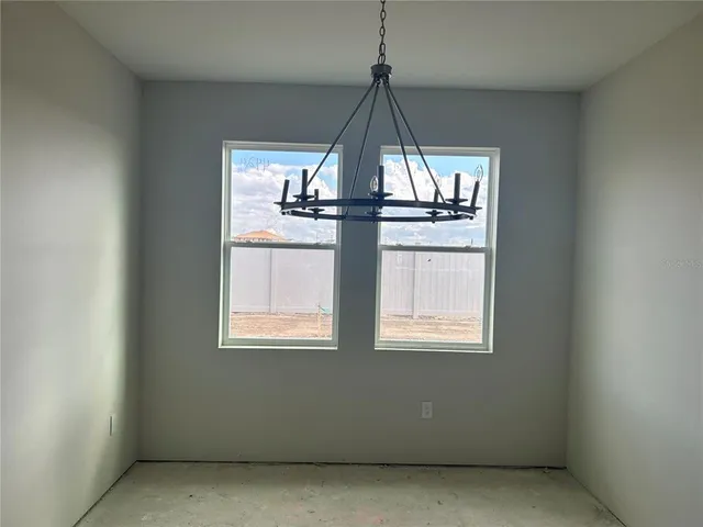 a view of an empty room and window