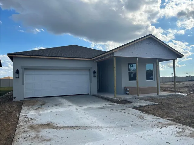 a view of house with garage