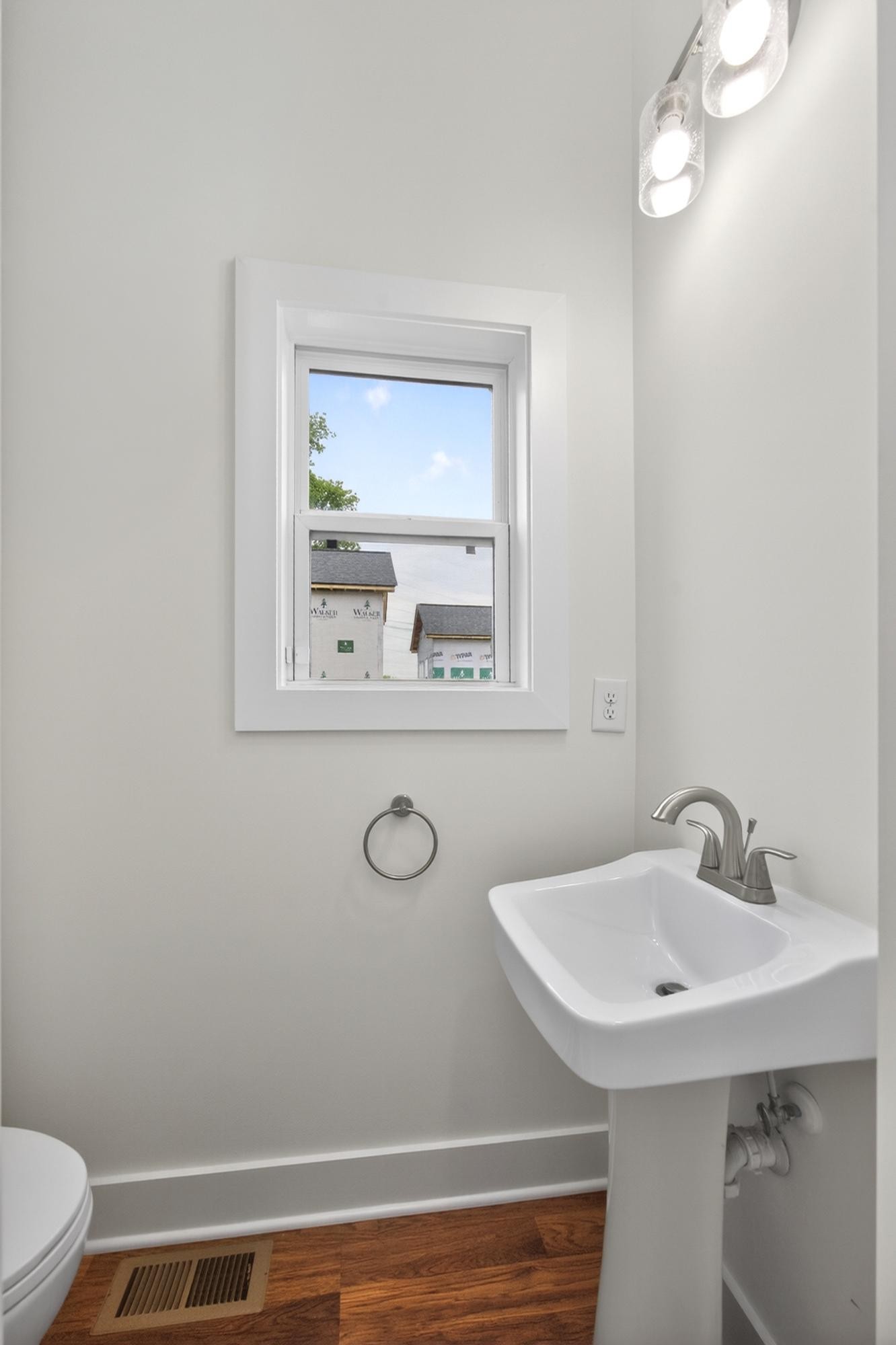 7 Decatur Street Nashville, TN 37210 - Photo 19 of 43 a bathroom with a sink a toilet and mirror