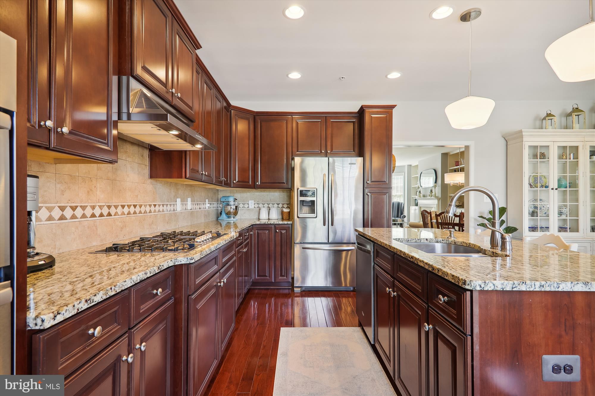 1609 Poplar Run Drive Silver Spring, MD 20906 - Photo 28 of 71 a kitchen with stainless steel appliances granite countertop a sink stove and refrigerator