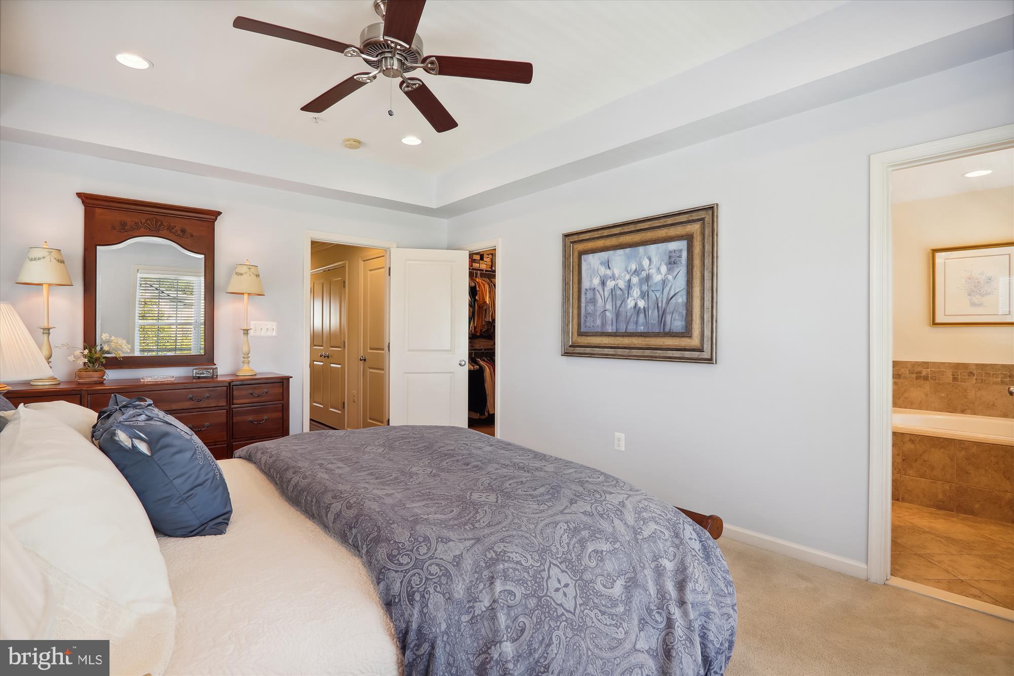 1609 Poplar Run Drive Silver Spring, MD 20906 - Photo 37 of 71 a bedroom with a large bed and a chandelier
