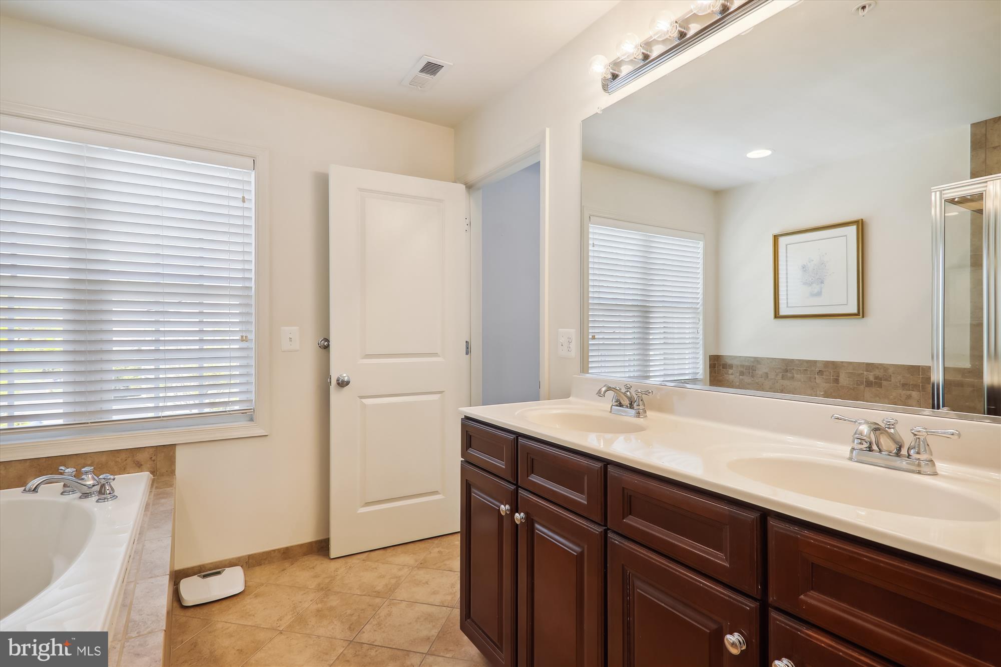 1609 Poplar Run Drive Silver Spring, MD 20906 - Photo 39 of 71 a bathroom with a sink double vanity and a mirror