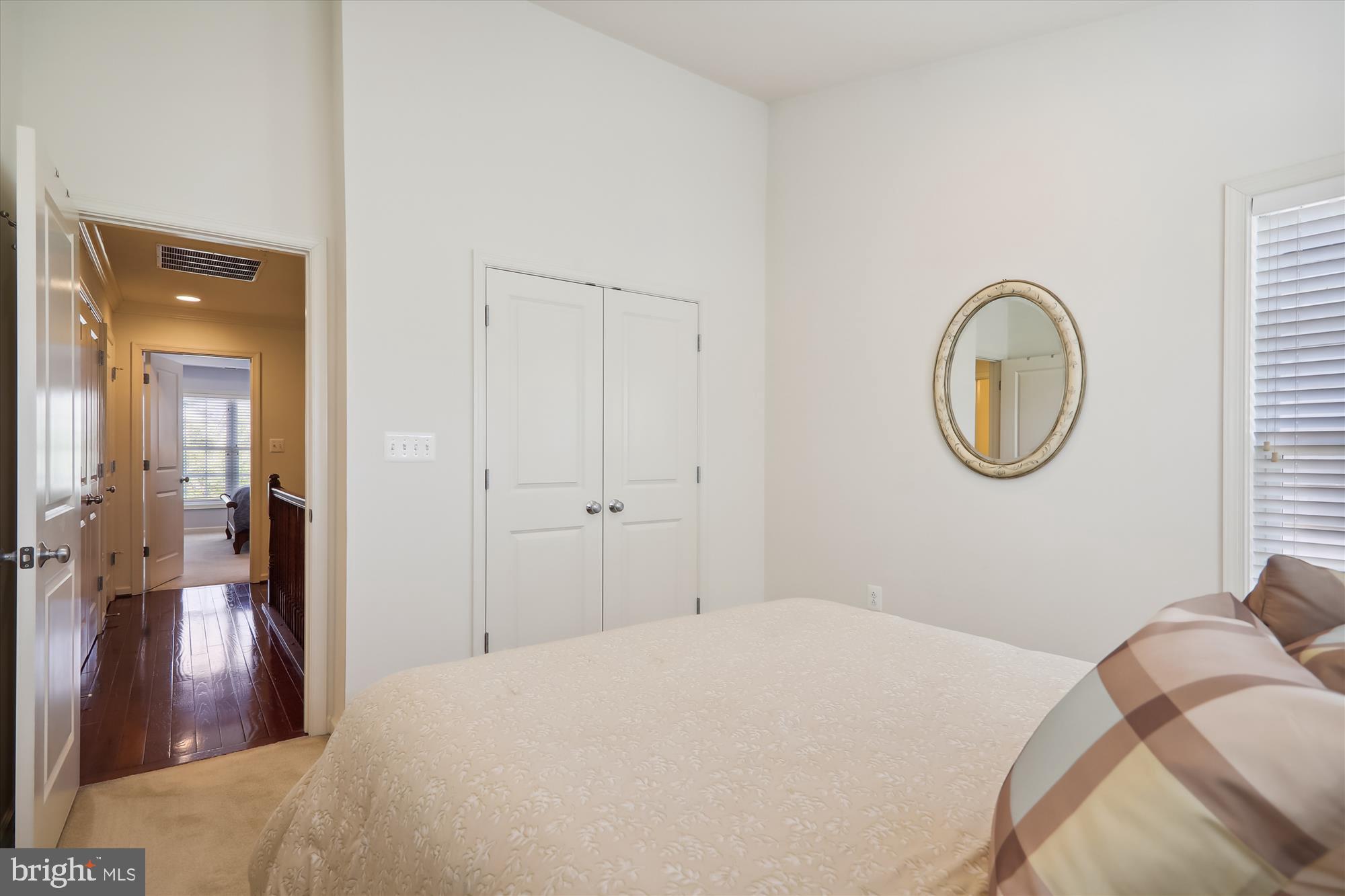 1609 Poplar Run Drive Silver Spring, MD 20906 - Photo 47 of 71 a bedroom with a bed and a mirror
