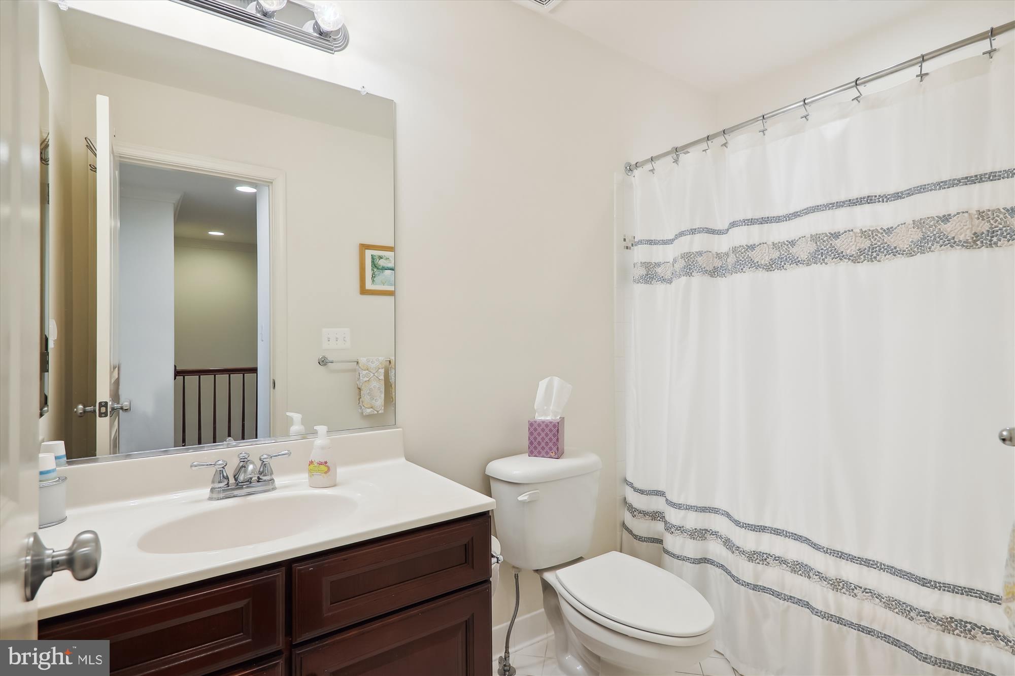1609 Poplar Run Drive Silver Spring, MD 20906 - Photo 49 of 71 a bathroom with a sink vanity mirror and toilet