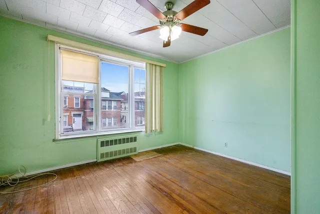 a bathroom with a shower toilet and sink