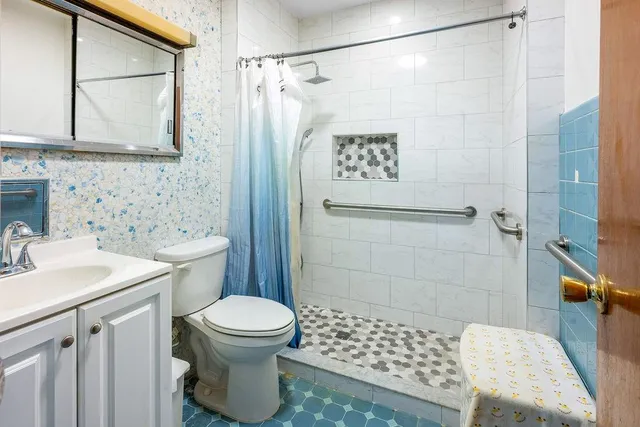 a view of a living room and kitchen