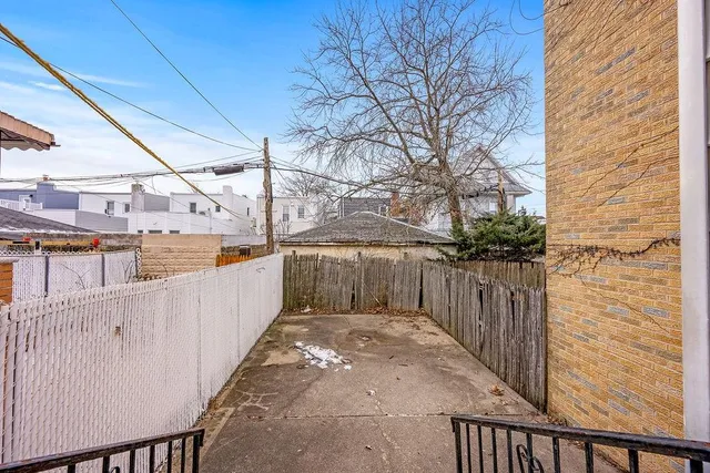 a view of a brick building with many windows