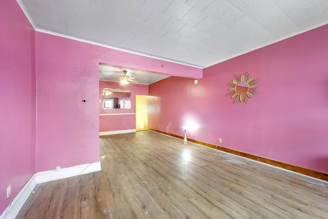 a view of gallery with wooden floor