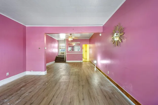 a view of a livingroom with a dining table and a window