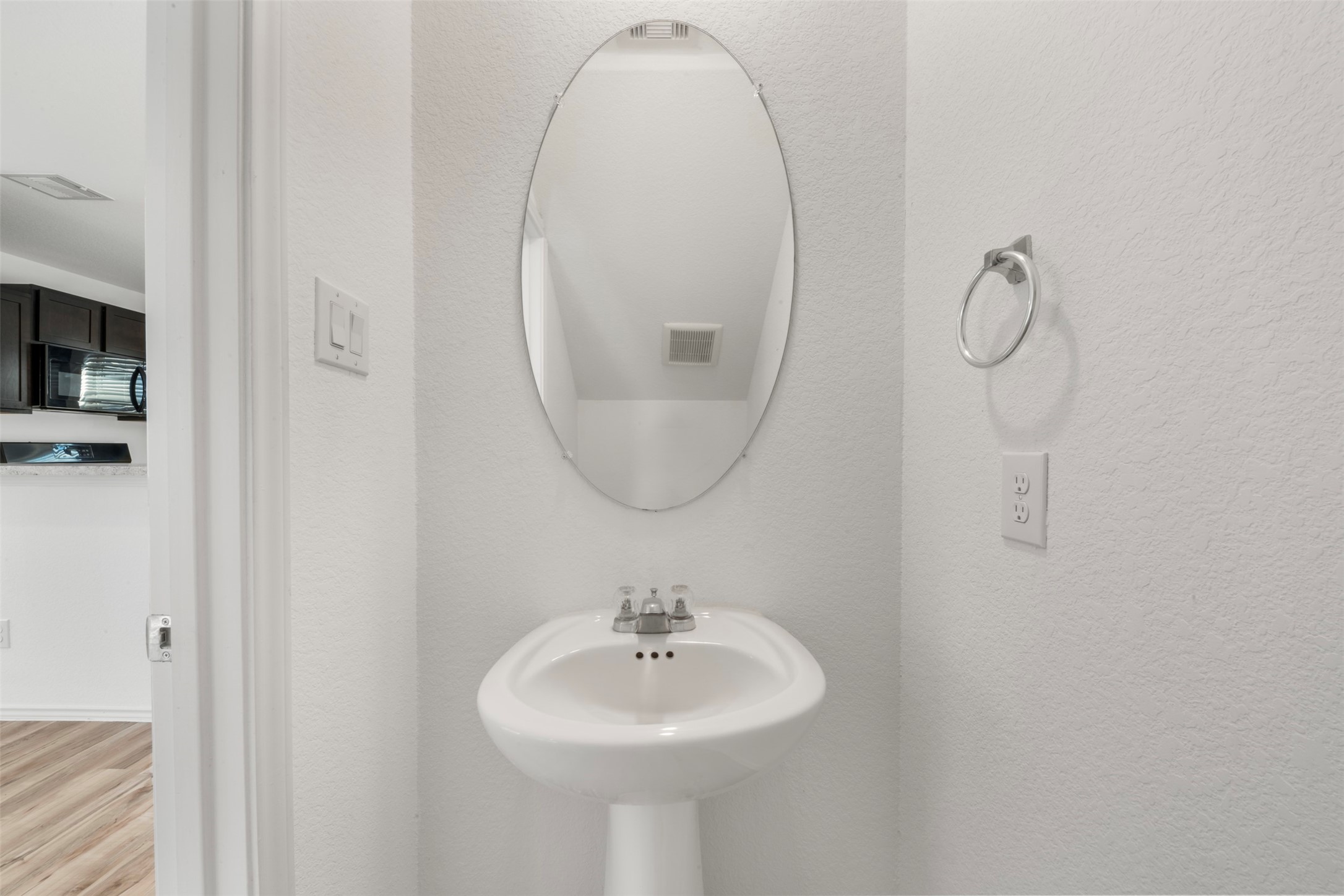 14538 Broadbury Pond Road Rosharon, TX 77583 - Photo 7 of 25 a bathroom with a sink a mirror and a light fixture