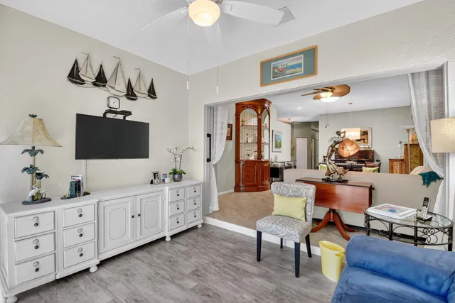 a kitchen with a sink window and cabinets