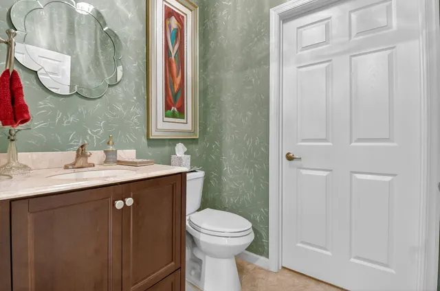 a view of a yard with a street from a balcony