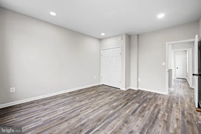 a view of room with wooden floor
