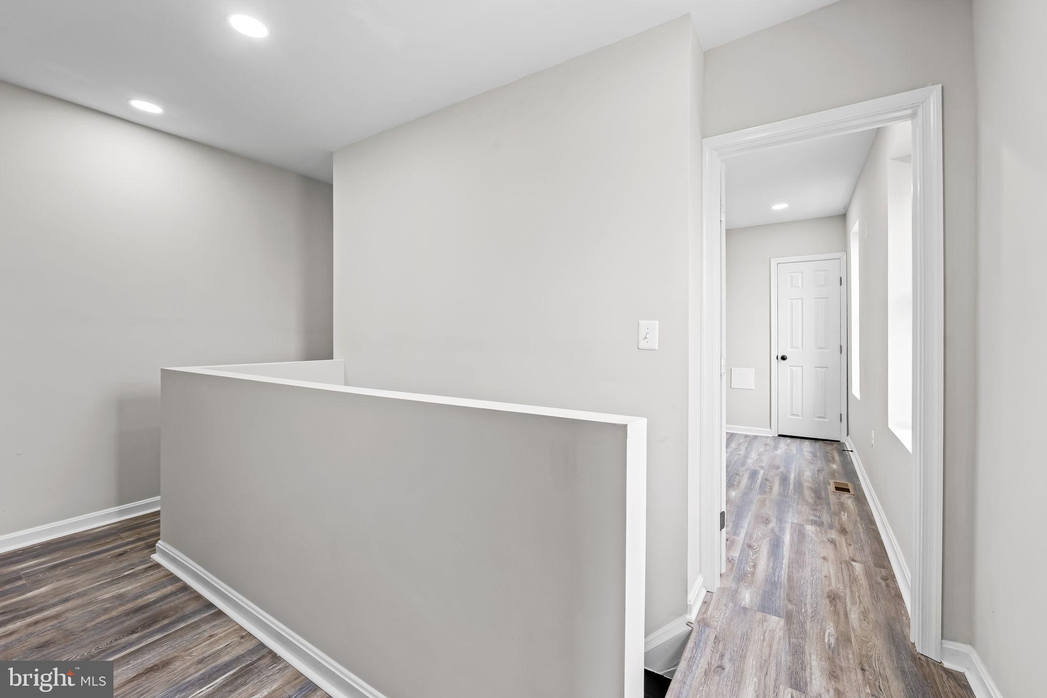 1918 East Lafayette Avenue Baltimore, MD 21213 - Photo 17 of 30 a view of hallway with wooden floor