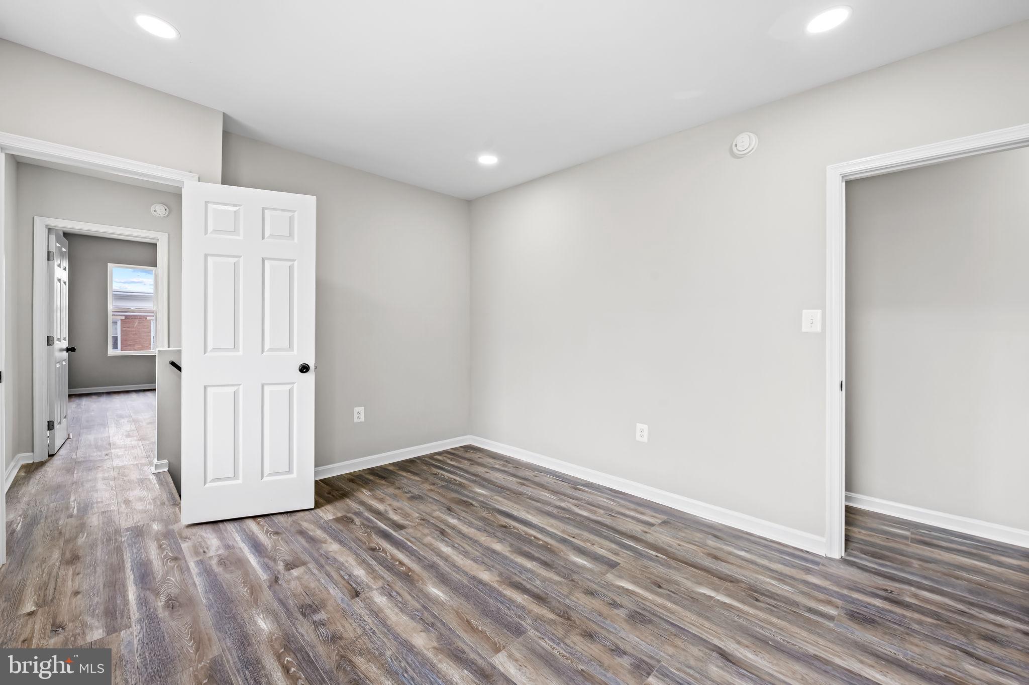1918 East Lafayette Avenue Baltimore, MD 21213 - Photo 18 of 30 a view of wooden floor in an empty room