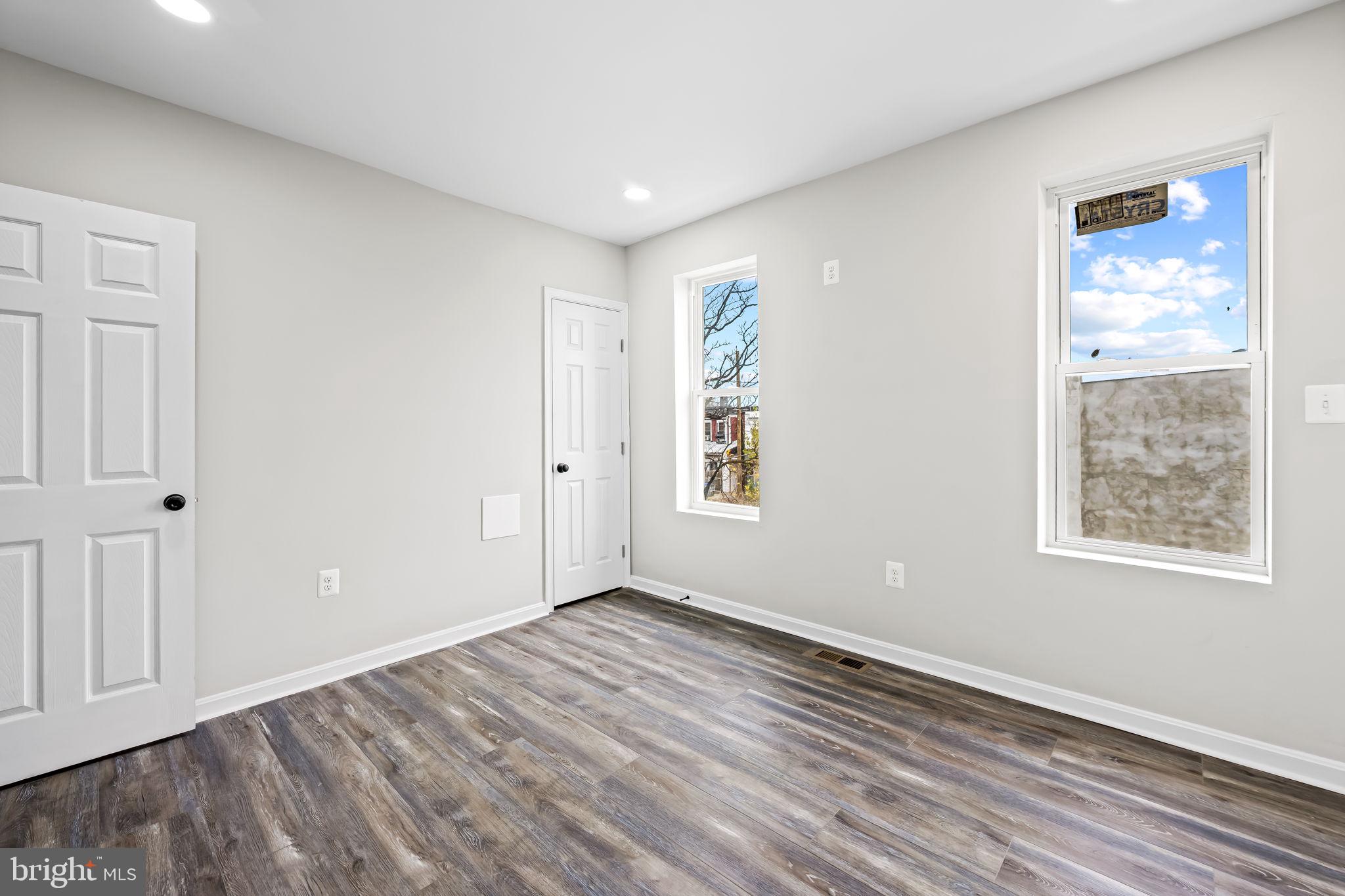 1918 East Lafayette Avenue Baltimore, MD 21213 - Photo 19 of 30 a view of empty room with wooden floor and fan