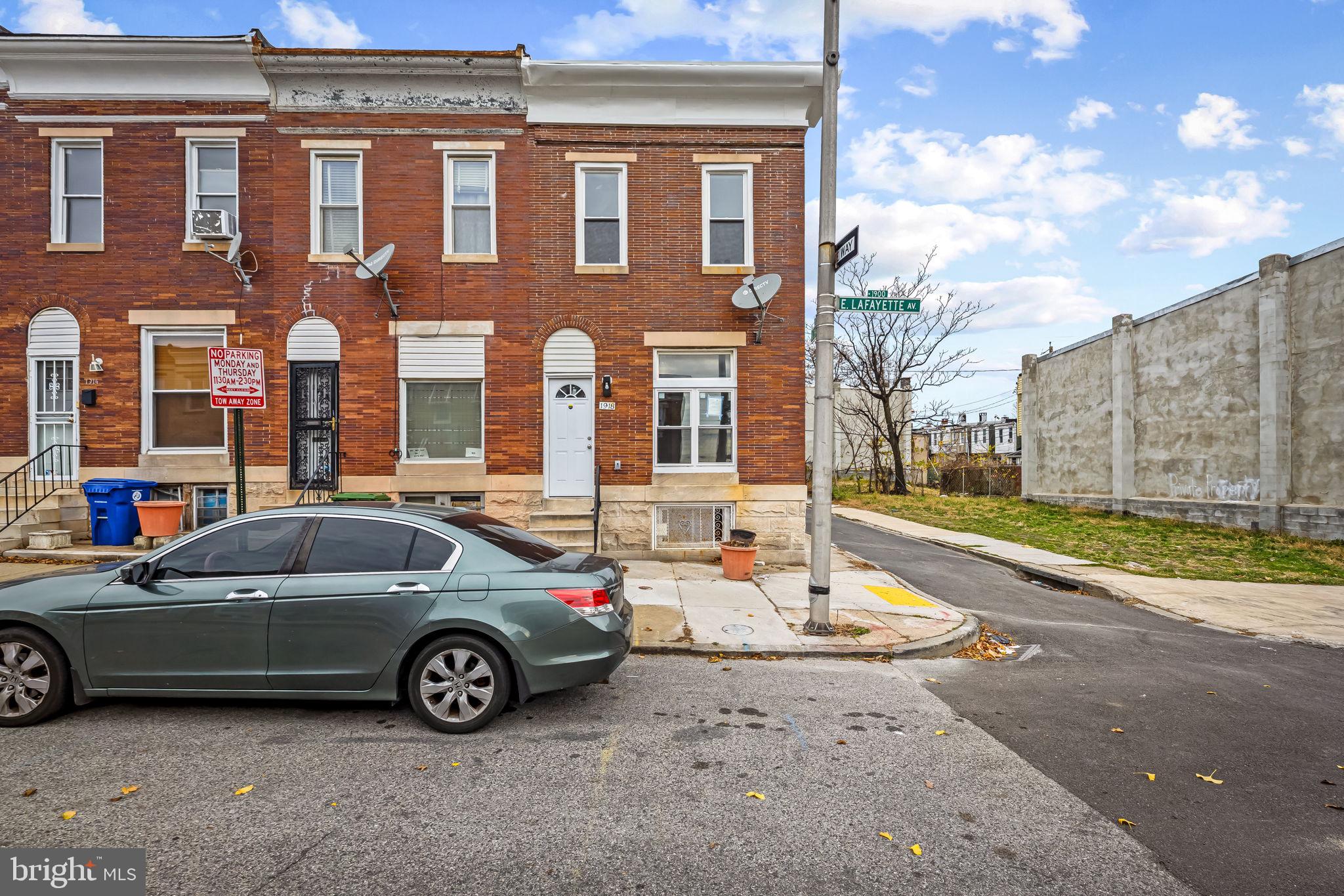 1918 East Lafayette Avenue Baltimore, MD 21213 - Photo 2 of 30 a car parked in front of a building