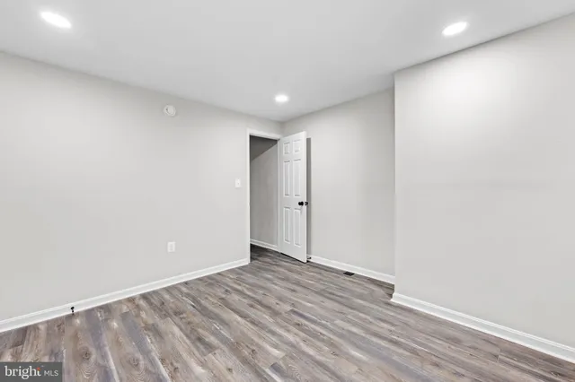 a view of hallway with wooden floor