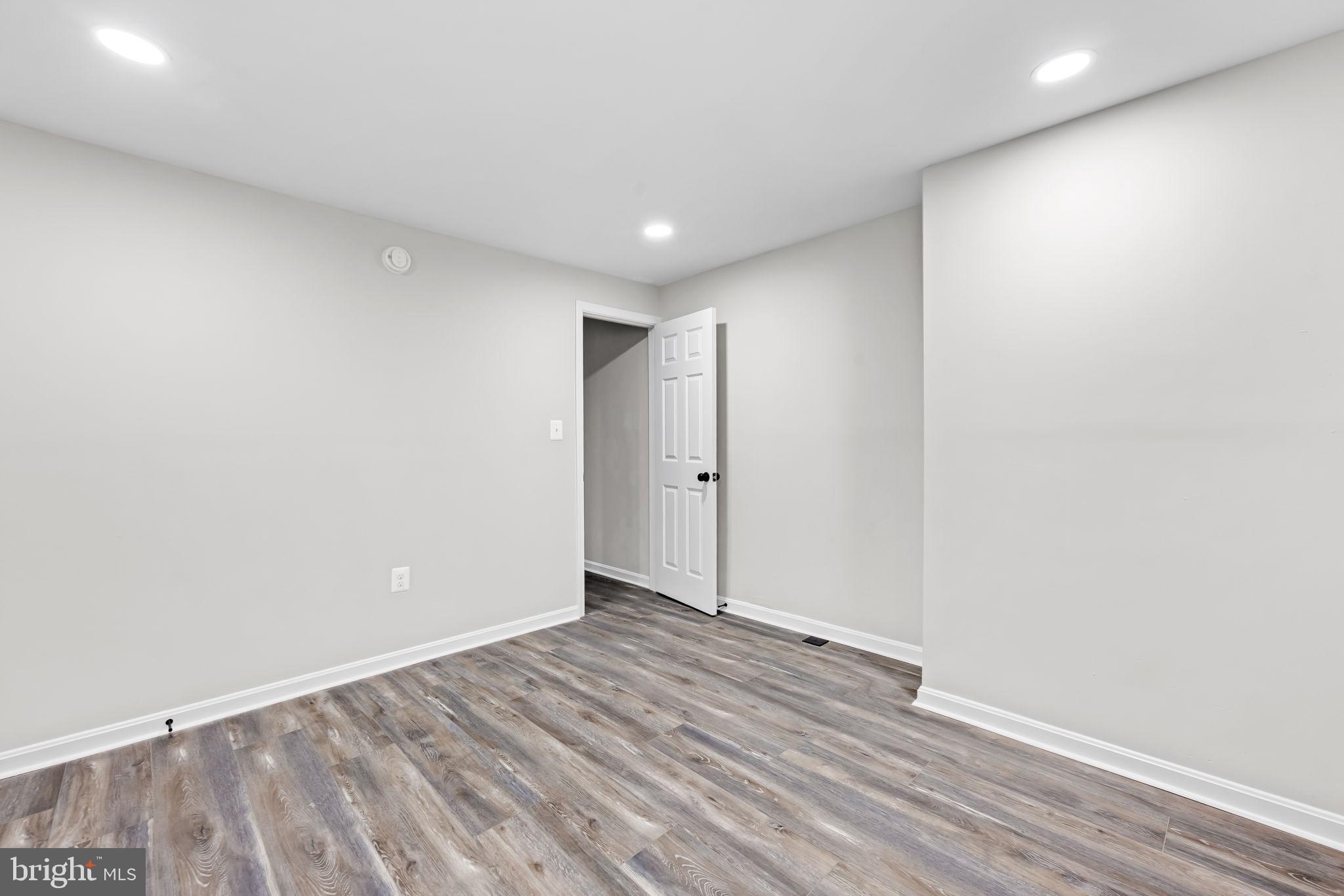 1918 East Lafayette Avenue Baltimore, MD 21213 - Photo 22 of 30 a view of hallway with wooden floor