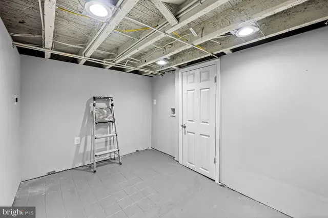 an empty room with white walls