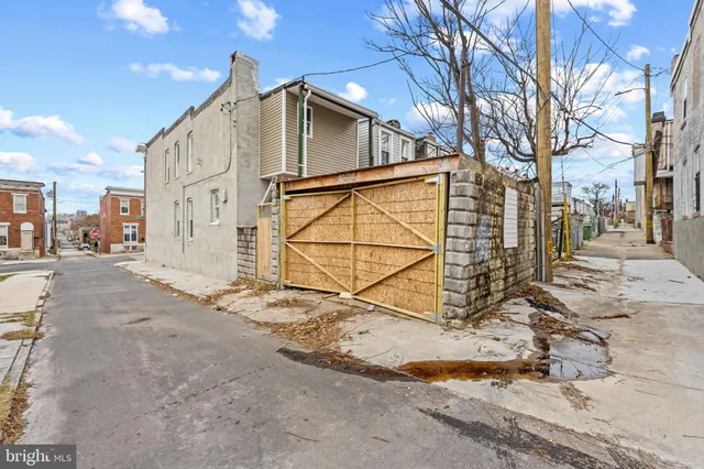 a view of a house with a snow on the road