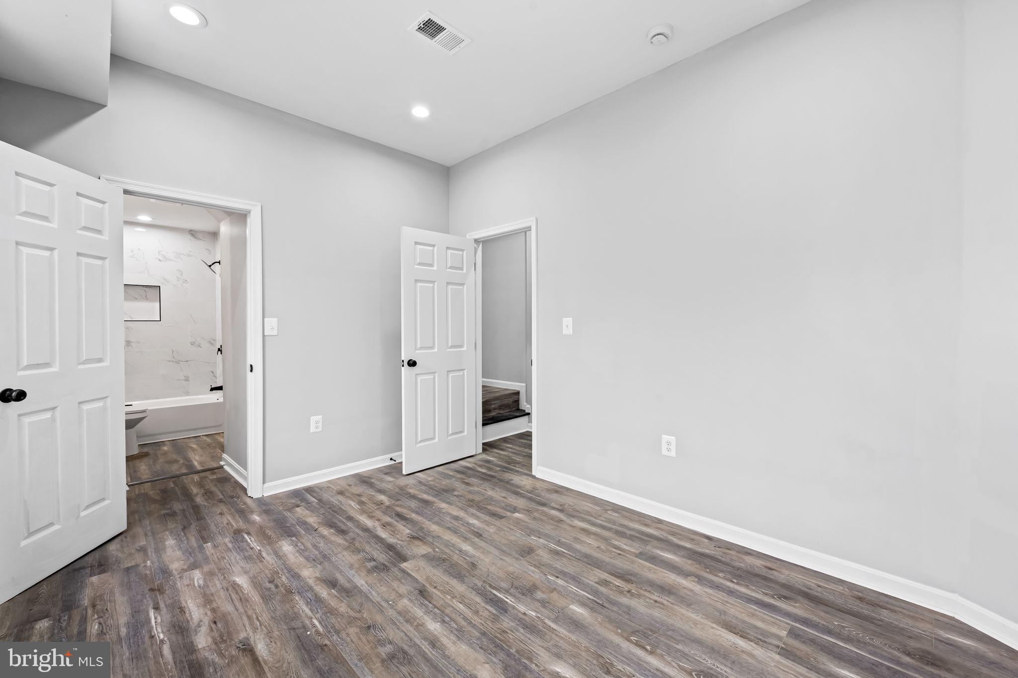 1918 East Lafayette Avenue Baltimore, MD 21213 - Photo 6 of 30 wooden floor in an empty room