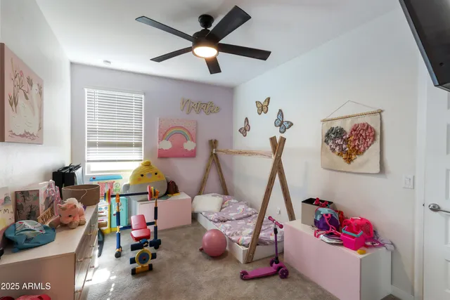 a bed room with furniture and a chandelier