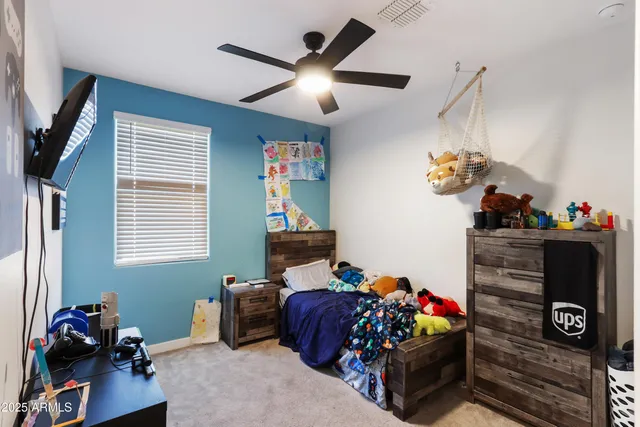 a bedroom with bed and a window