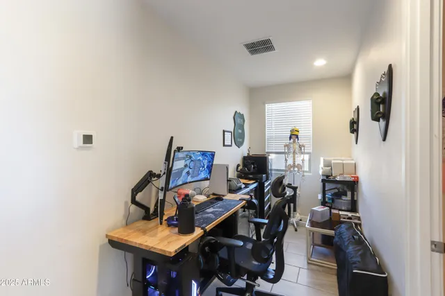 a view of a workspace with furniture