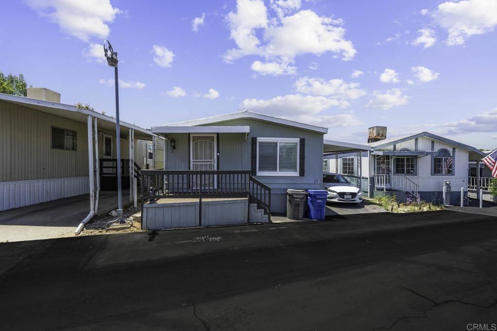 7908 Rancho Fanita Drive, Unit SPC 25 Santee, CA 92071 - Photo 11 of 19 a view of a street that has couple of cars parked on the road