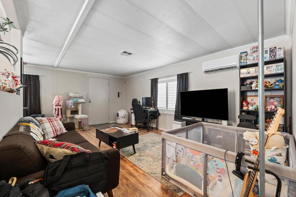 7908 Rancho Fanita Drive, Unit SPC 25 Santee, CA 92071 - Photo 3 of 19 a living room with furniture and a flat screen tv