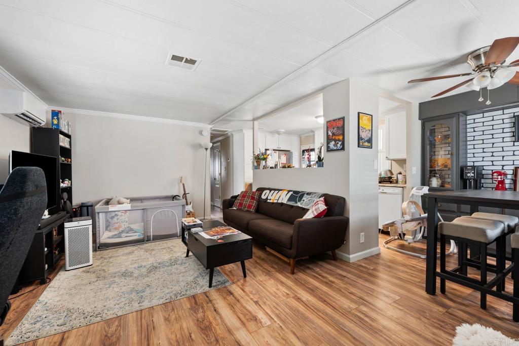 7908 Rancho Fanita Drive, Unit SPC 25 Santee, CA 92071 - Photo 4 of 19 a living room with furniture and a wooden floor