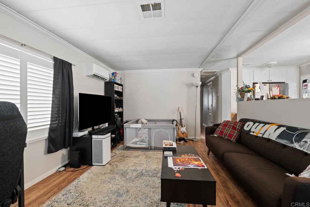 7908 Rancho Fanita Drive, Unit SPC 25 Santee, CA 92071 - Photo 5 of 19 a living room with furniture and a flat screen tv