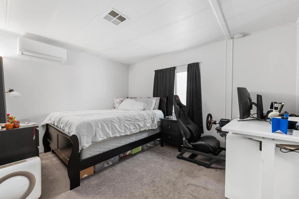 7908 Rancho Fanita Drive, Unit SPC 25 Santee, CA 92071 - Photo 6 of 19 a spacious bedroom with a bed and a flat screen tv