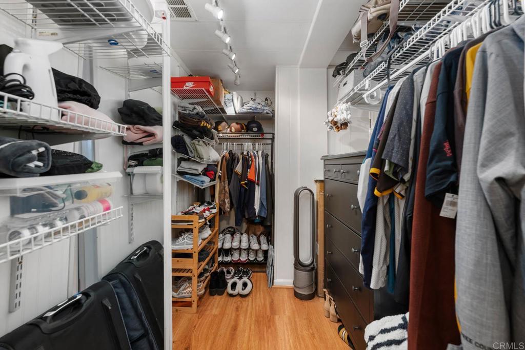 7908 Rancho Fanita Drive, Unit SPC 25 Santee, CA 92071 - Photo 10 of 19 a view of walk in closet with clothes and shoes