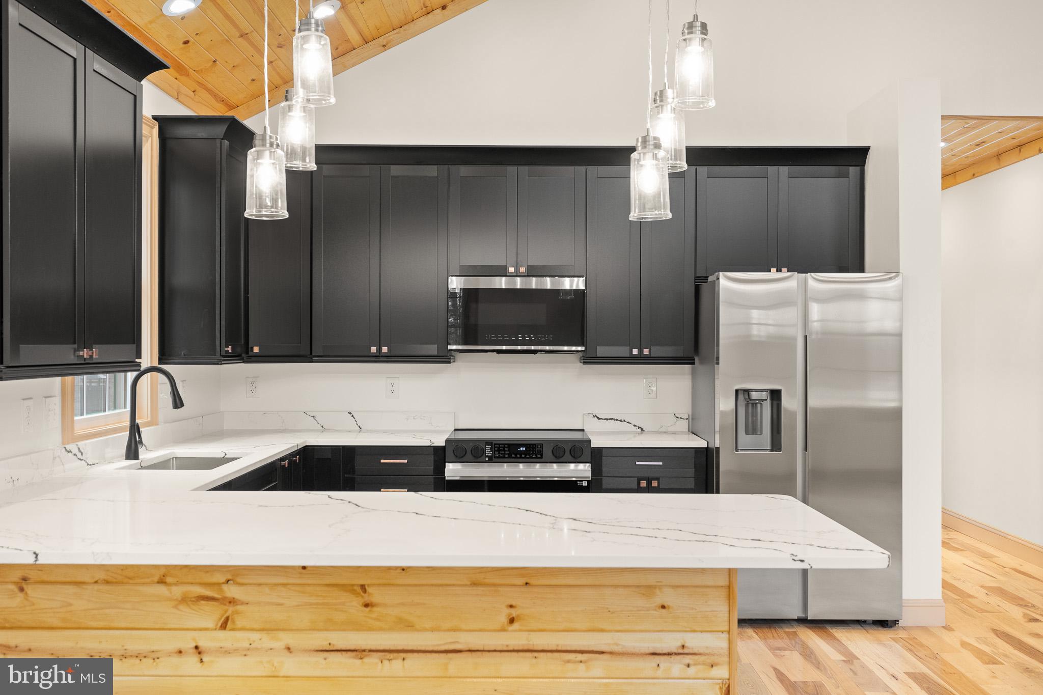 8399 Supinlick Ridge Road Mount Jackson, VA 22842 - Photo 11 of 39 Sleek modern kitchen with rustic charm.