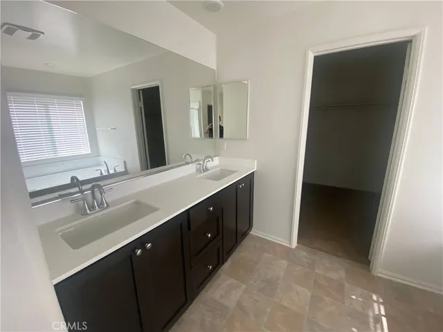 a bedroom with a bed and a chair