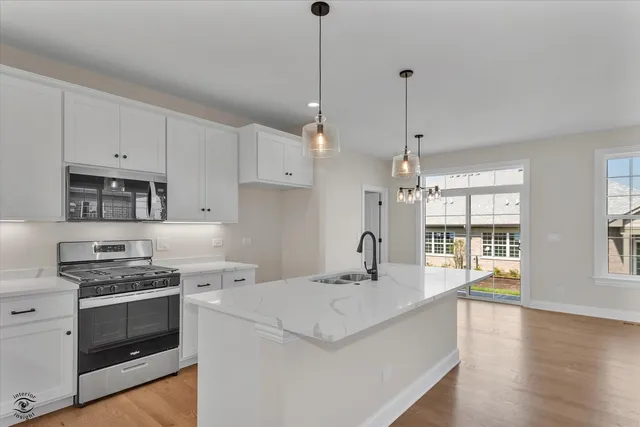 a kitchen that has a lot of cabinets in it