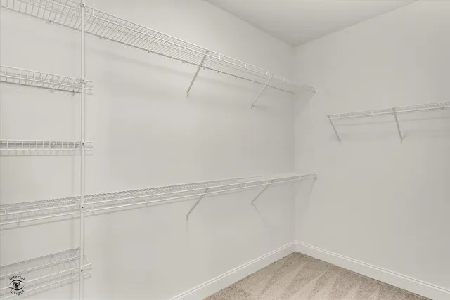 a bathroom with a sink double vanity granite tub and shower