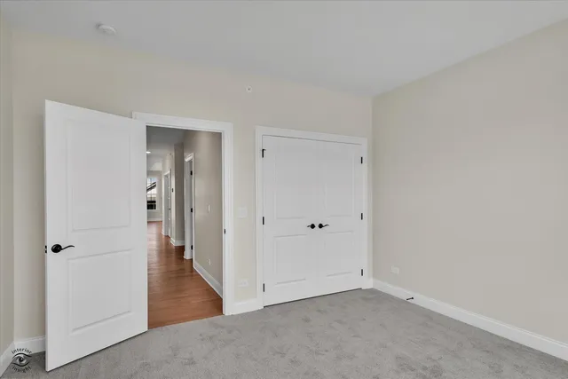 a bathroom with a sink a toilet a mirror and shower